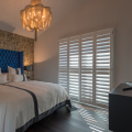 Bedroom with White Grained Tracked Shutter Ashwood